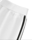 Side waistband detail closeup of the Athlesi TrackLine Performance Skort in white