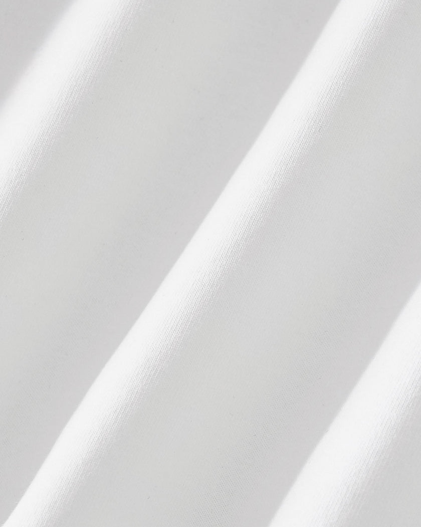 Closeup of the stretch performance fabric texture on the Athlesi TrackLine Performance Skort in white