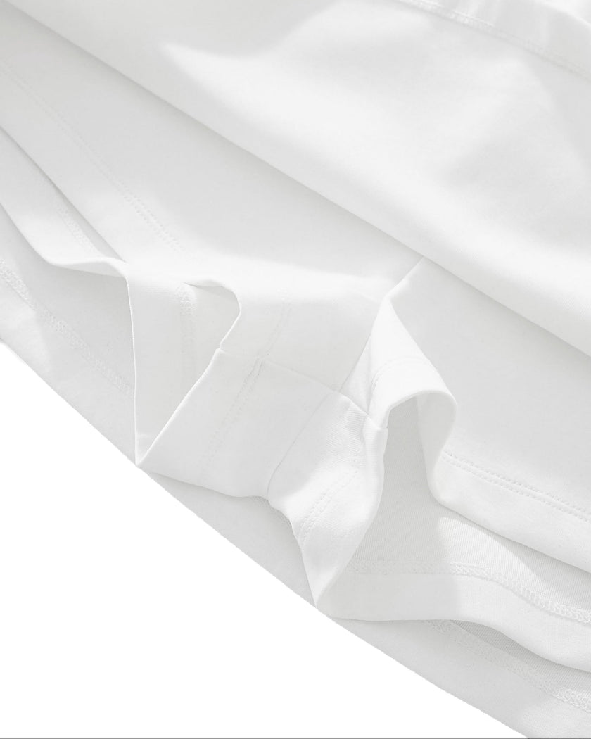 Hem detail closeup of the Athlesi TrackLine Performance Skort in white