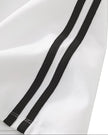 Closeup of the side stripe detailing on the Athlesi TrackLine Performance Skort in white