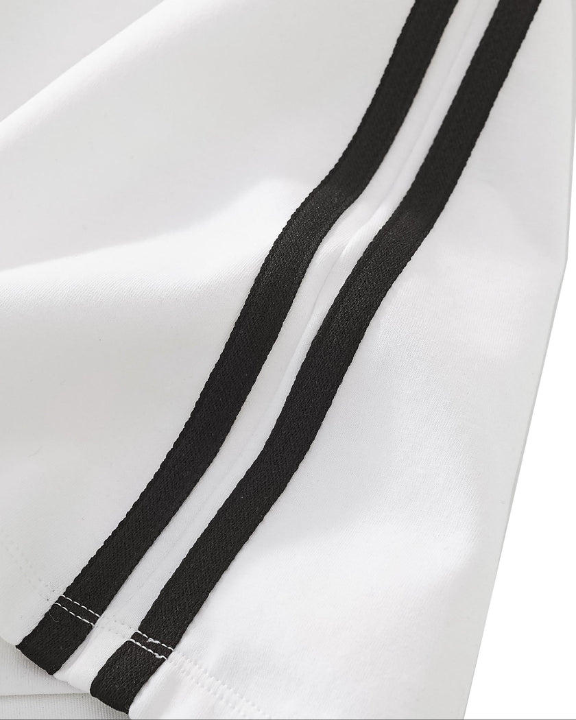 Closeup of the side stripe detailing on the Athlesi TrackLine Performance Skort in white