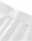 Front waistband closeup of the Athlesi TrackLine Performance Skort in white