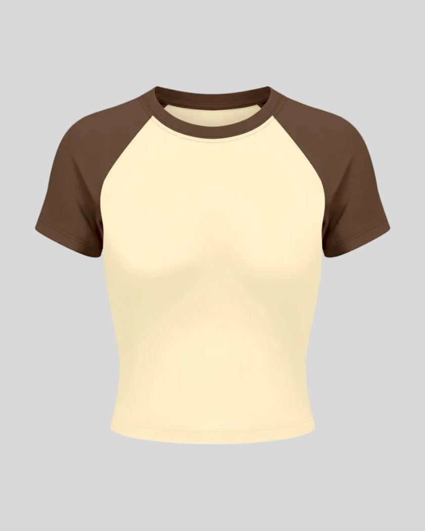 TrackLine Raglan Baby Tee in Apricot with Coffee front view with contrast short sleeves and crew neckline