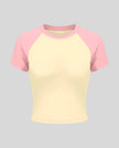 TrackLine Raglan Baby Tee in Apricot with Pink front view with contrast short sleeves and crew neckline