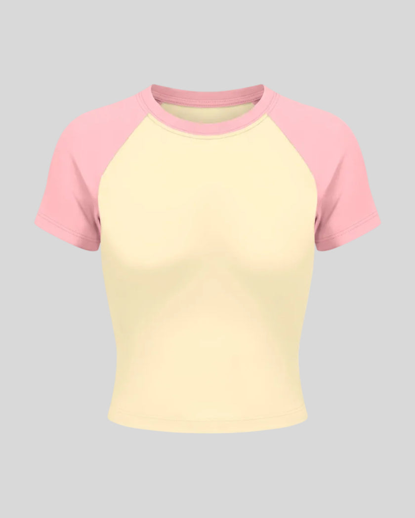 TrackLine Raglan Baby Tee in Apricot with Pink front view with contrast short sleeves and crew neckline