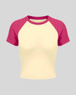 TrackLine Raglan Baby Tee in Apricot with Rose Red front view with contrast short sleeves and crew neckline
