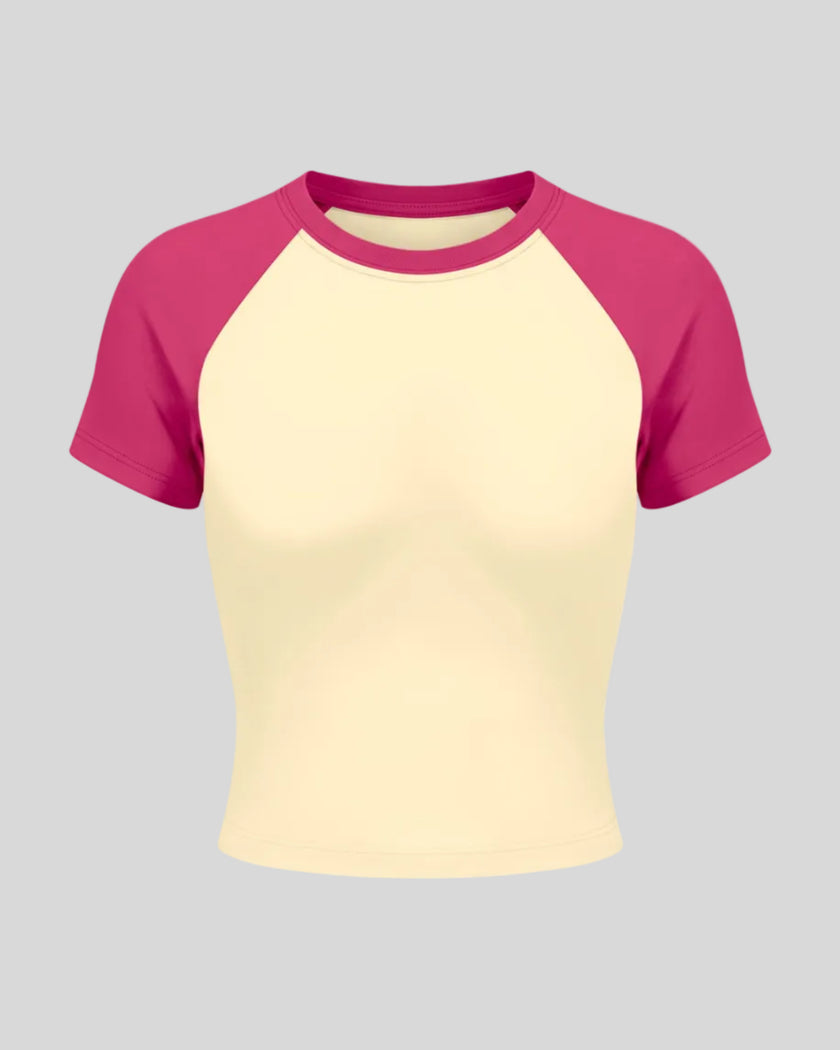 TrackLine Raglan Baby Tee in Apricot with Rose Red front view with contrast short sleeves and crew neckline