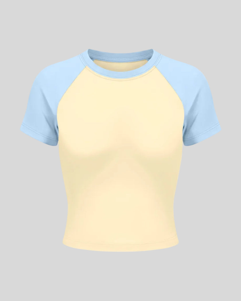 TrackLine Raglan Baby Tee in Apricot with Sky Blue front view with contrast short sleeves and crew neckline