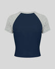 TrackLine Raglan Baby Tee in Navy Blue and Flower Gray back view with contrast raglan sleeves and fitted silhouette