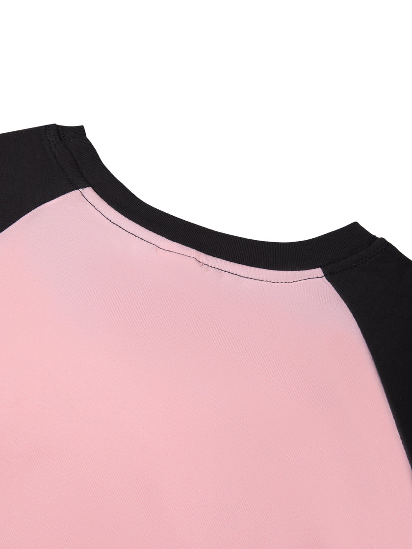 Back neckline close-up of TrackLine Raglan Baby Tee in Pink with Black showing contrast trim and raglan construction