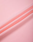 Close-up of the soft stretch cotton-blend fabric on the TrackLine Raglan Baby Tee in Pink with Black