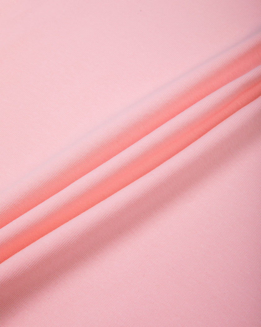 Close-up of the soft stretch cotton-blend fabric on the TrackLine Raglan Baby Tee in Pink with Black