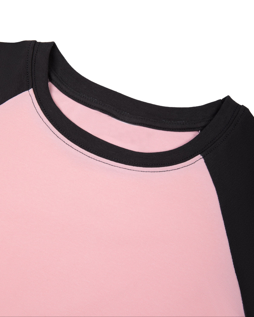 Front neckline close-up of TrackLine Raglan Baby Tee in Pink with Black showing contrast crewneck trim