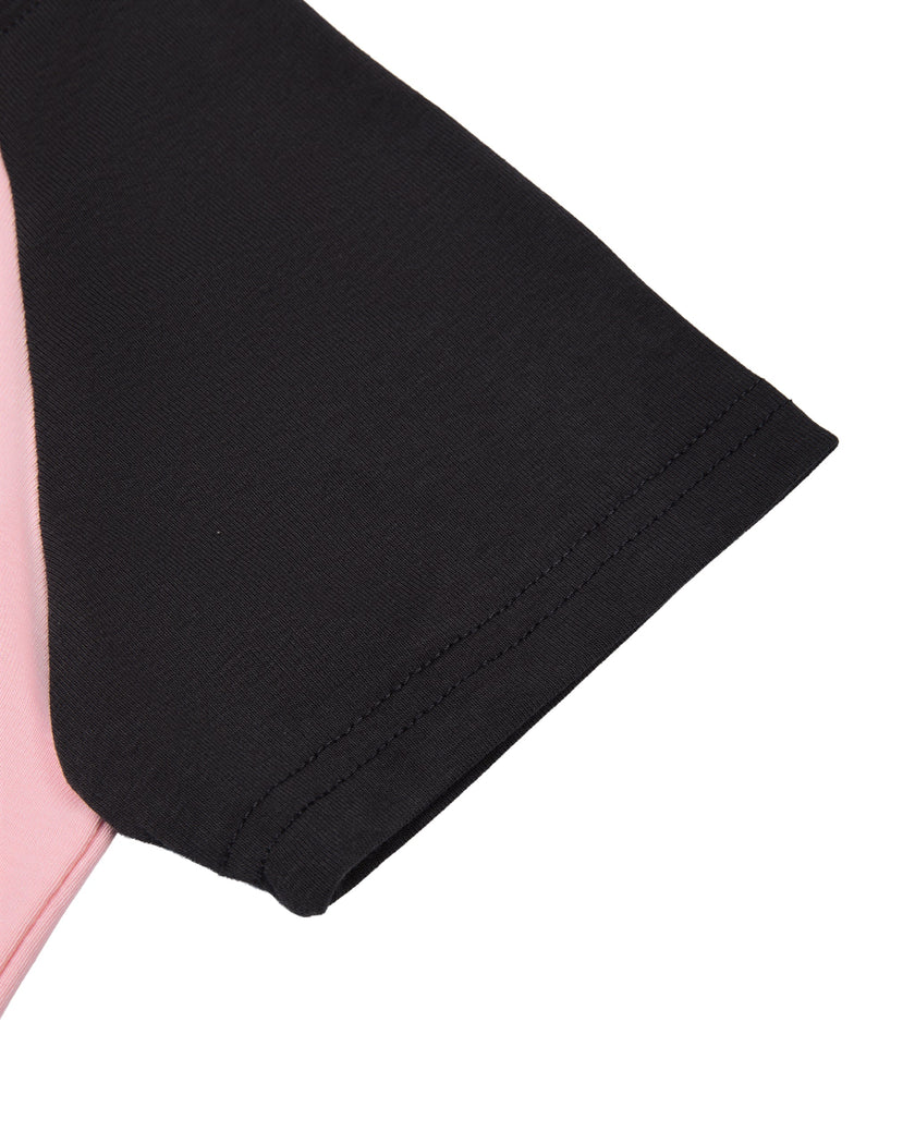 Sleeve close-up of TrackLine Raglan Baby Tee showing Black contrast raglan sleeve against the Pink body
