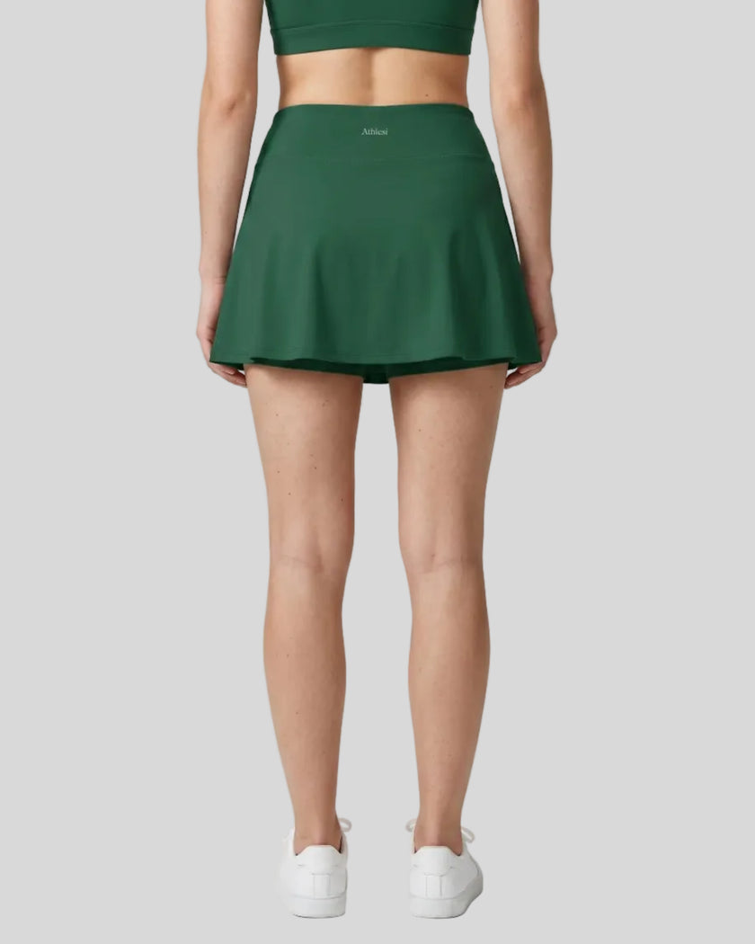 Back view of the TrackLine Rally A-Line Slit Skirt in blackish green on model
