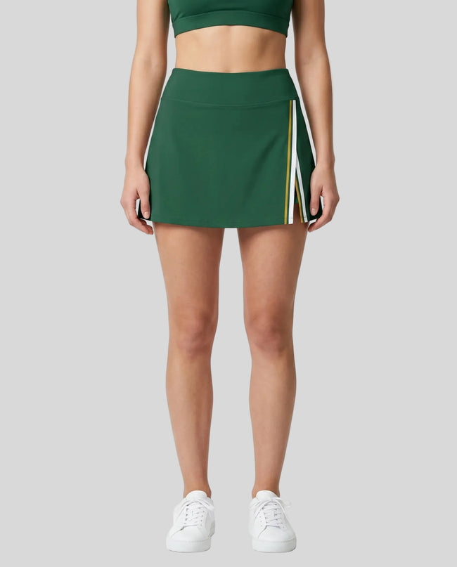 Model wearing the TrackLine Rally A-Line Slit Skirt in blackish green front view