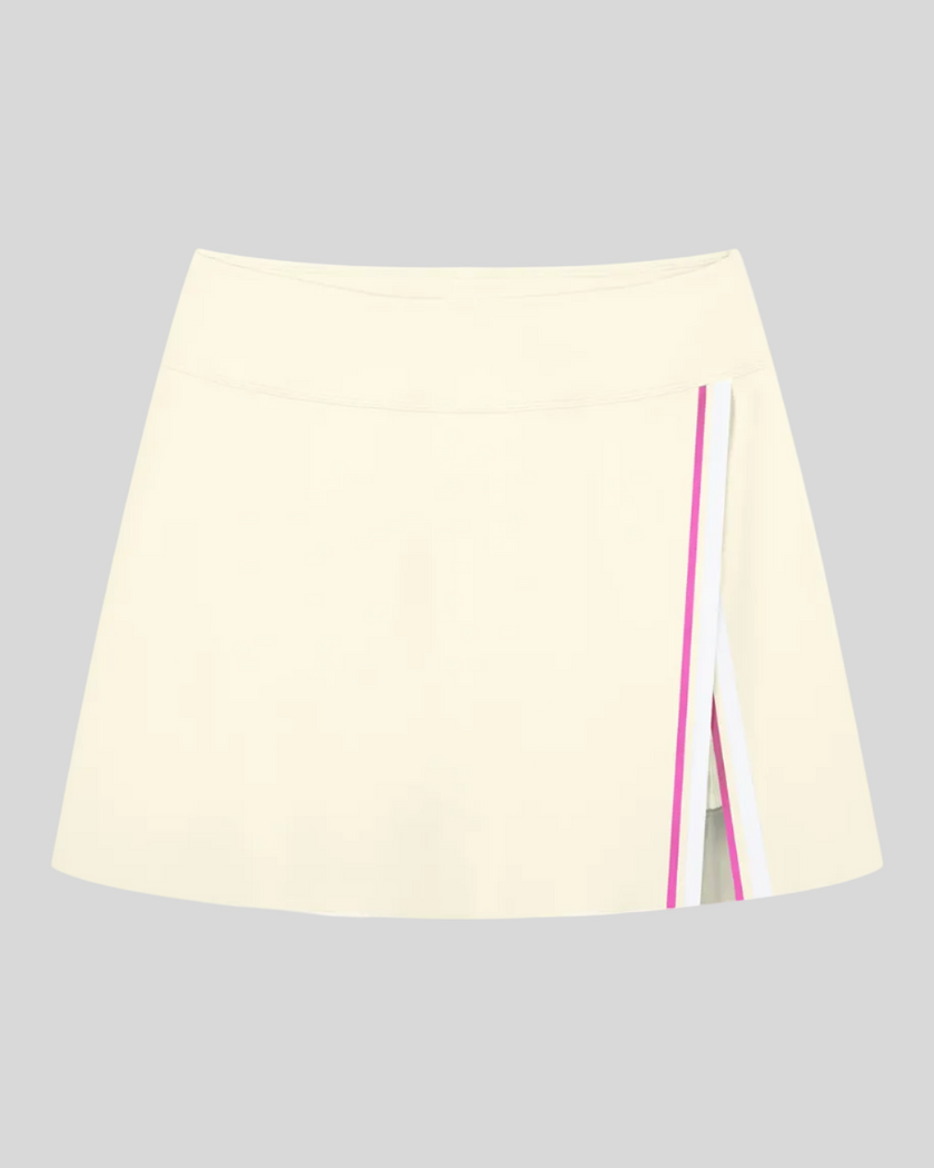 TrackLine Rally A-Line Slit Skirt in light apricot featuring contrast side panels and athletic slit detail front view