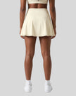Back view of the TrackLine Rally A-Line Slit Skirt in light apricot on model