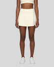 Model wearing the TrackLine Rally A-Line Slit Skirt in light apricot front view