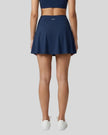Back view of the TrackLine Rally A-Line Slit Skirt in navy blue on model