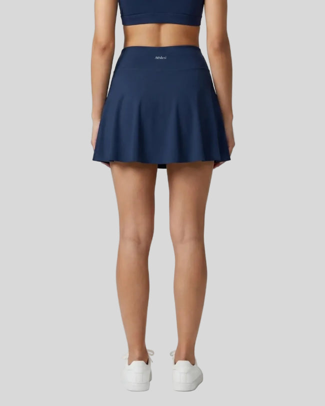 Back view of the TrackLine Rally A-Line Slit Skirt in navy blue on model