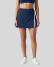 Model wearing the TrackLine Rally A-Line Slit Skirt in navy blue front view