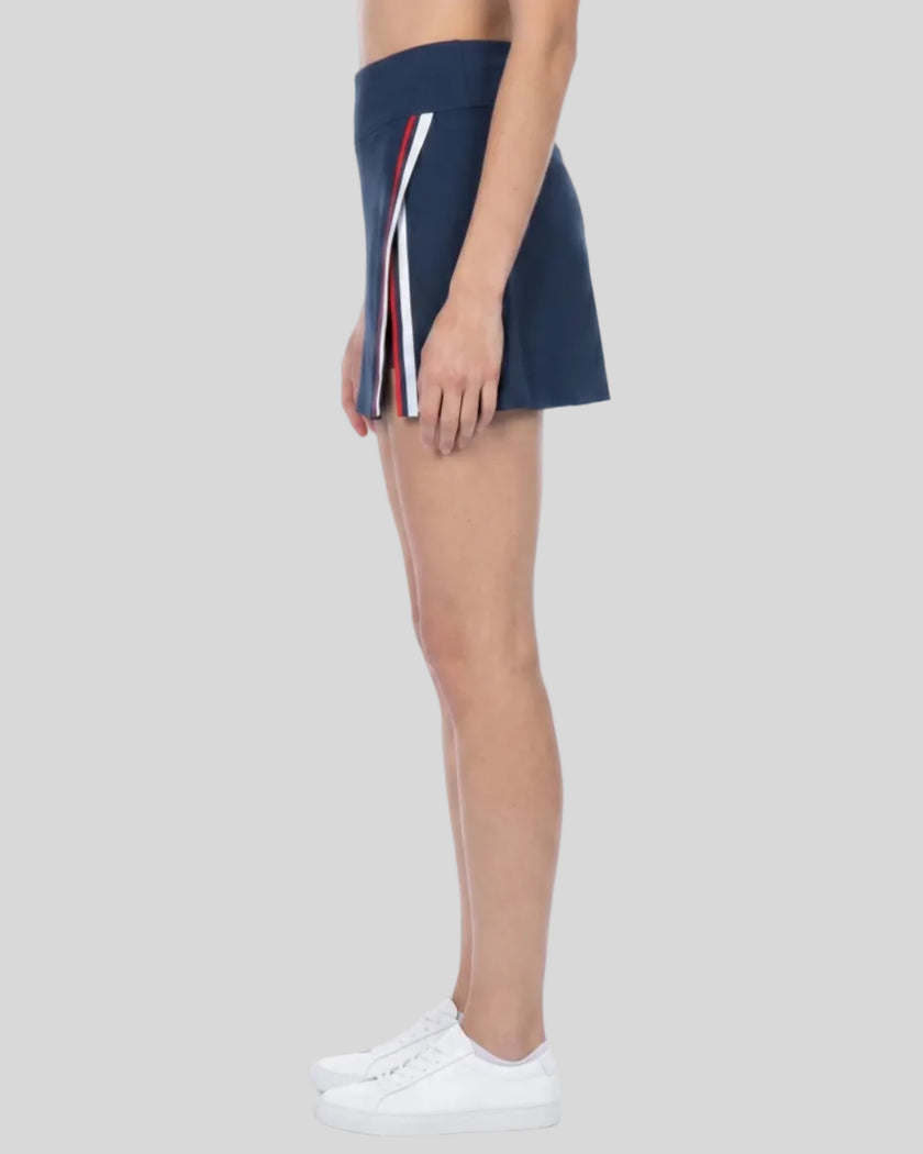 Side view of the TrackLine Rally A-Line Slit Skirt showcasing the athletic slit and movement-friendly silhouette