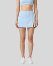 Model wearing the TrackLine Rally A-Line Slit Skirt in sky blue front view