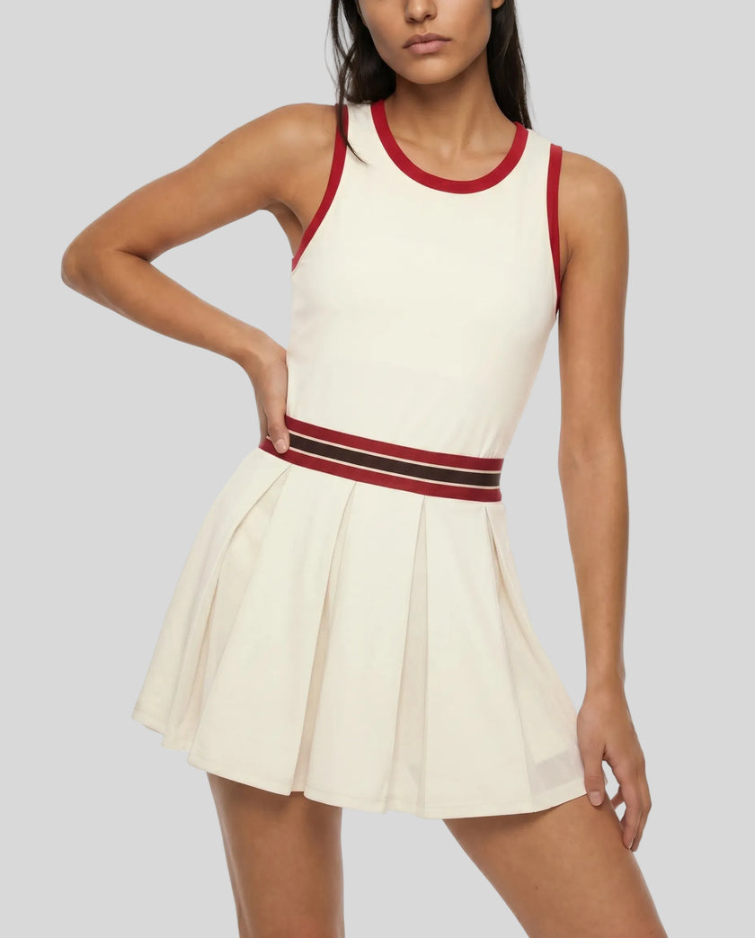 Model wearing the TrackLine Rally Dress in Beige angled front view