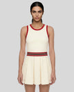 Model wearing the TrackLine Rally Dress in Beige front view