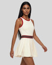 Model wearing the TrackLine Rally Dress in Beige angled front view