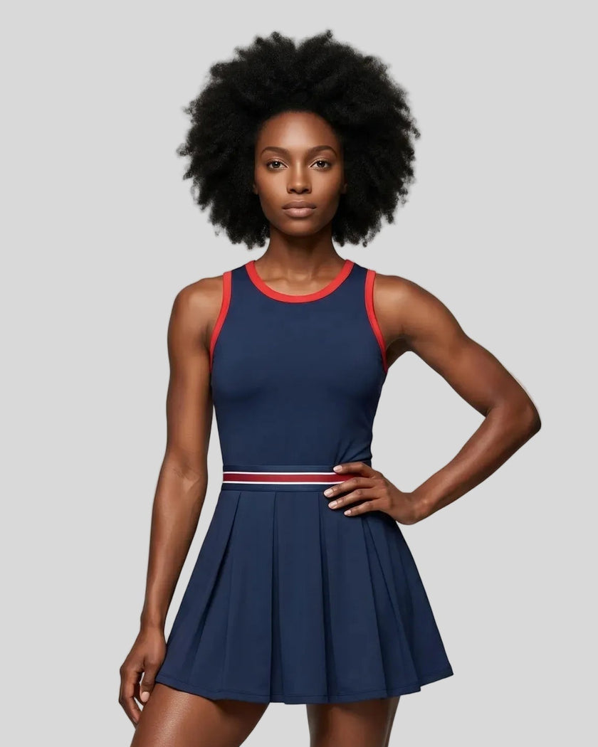 Model wearing the TrackLine Rally Dress in Navy Blue front view