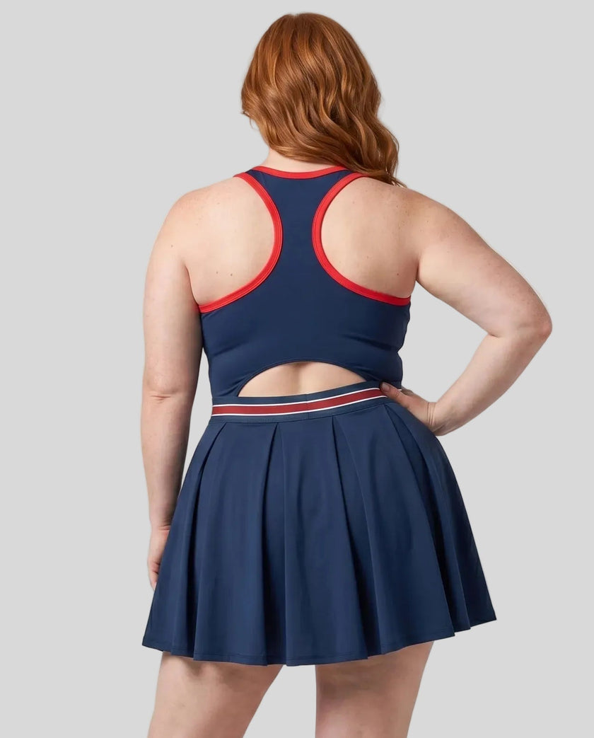 Model wearing the X-Large TrackLine Rally Dress in Navy Blue angled back view