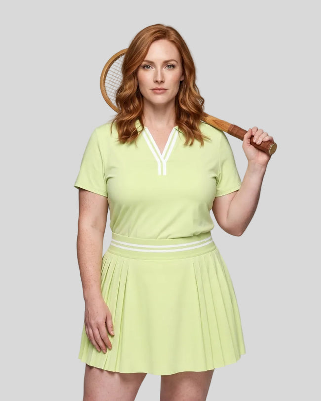 Model wearing the light green Athlesi TrackLine Rally Polo Shirt with white contrast neckline, front view