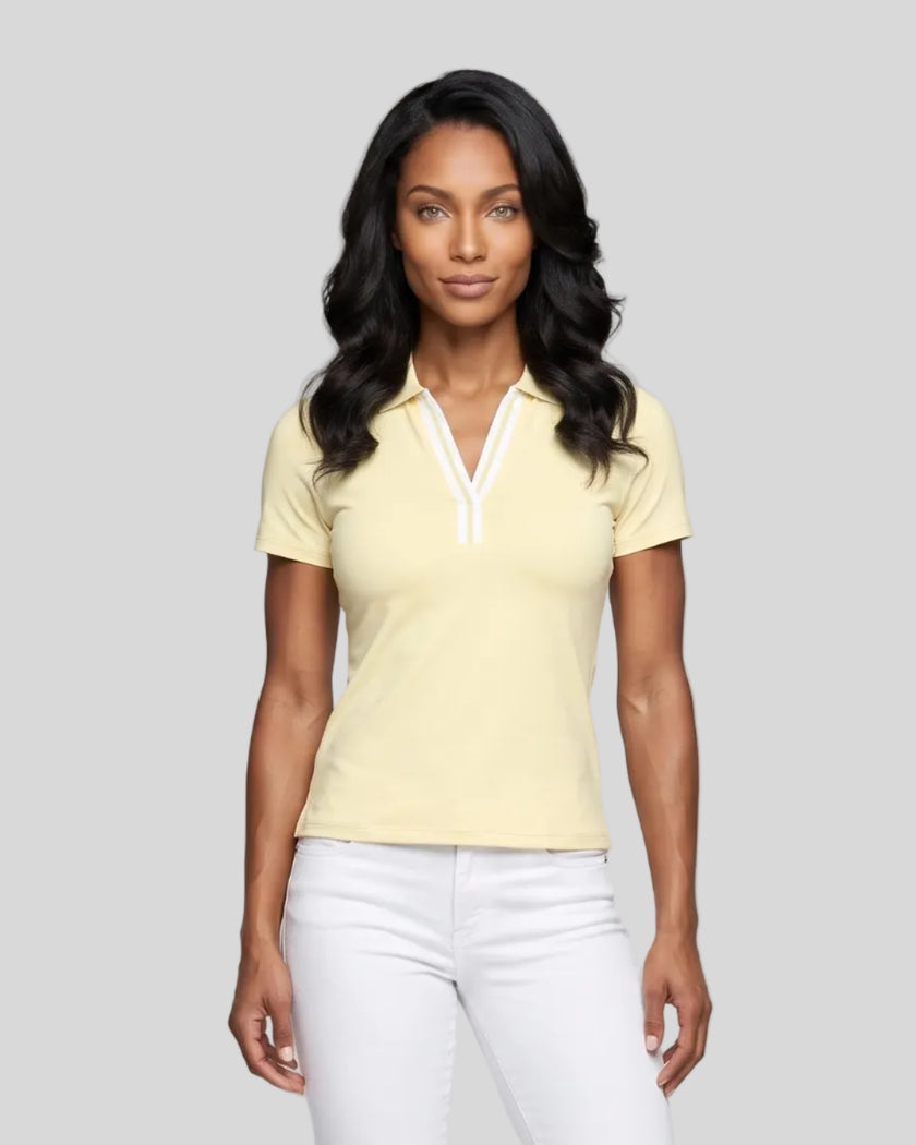 Model wearing the light yellow Athlesi TrackLine Rally Polo Shirt with white contrast neckline, front view