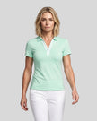 Model wearing the mint green Athlesi TrackLine Rally Polo Shirt with white contrast neckline, front view