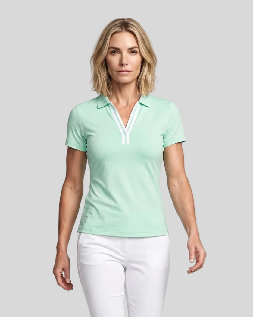 Model wearing the mint green Athlesi TrackLine Rally Polo Shirt with white contrast neckline, front view