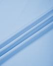 Close-up of the smooth stretch fabric on the sky blue Athlesi TrackLine Rally Polo Shirt