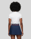 Model wearing the white Athlesi TrackLine Rally Polo Shirt, back view