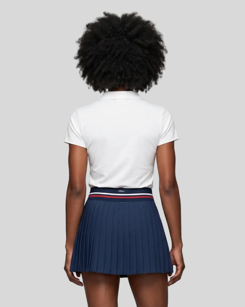 Model wearing the white Athlesi TrackLine Rally Polo Shirt, back view