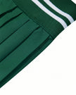 Side waistband closeup of TrackLine Rally Skirt in blackish green showing ribbed athletic finish