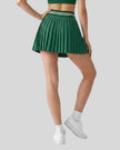 Back view of TrackLine Rally Skirt in blackish green featuring full pleated design