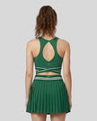 Back view of TrackLine Rally Sports Bra in blackish green featuring open-back design