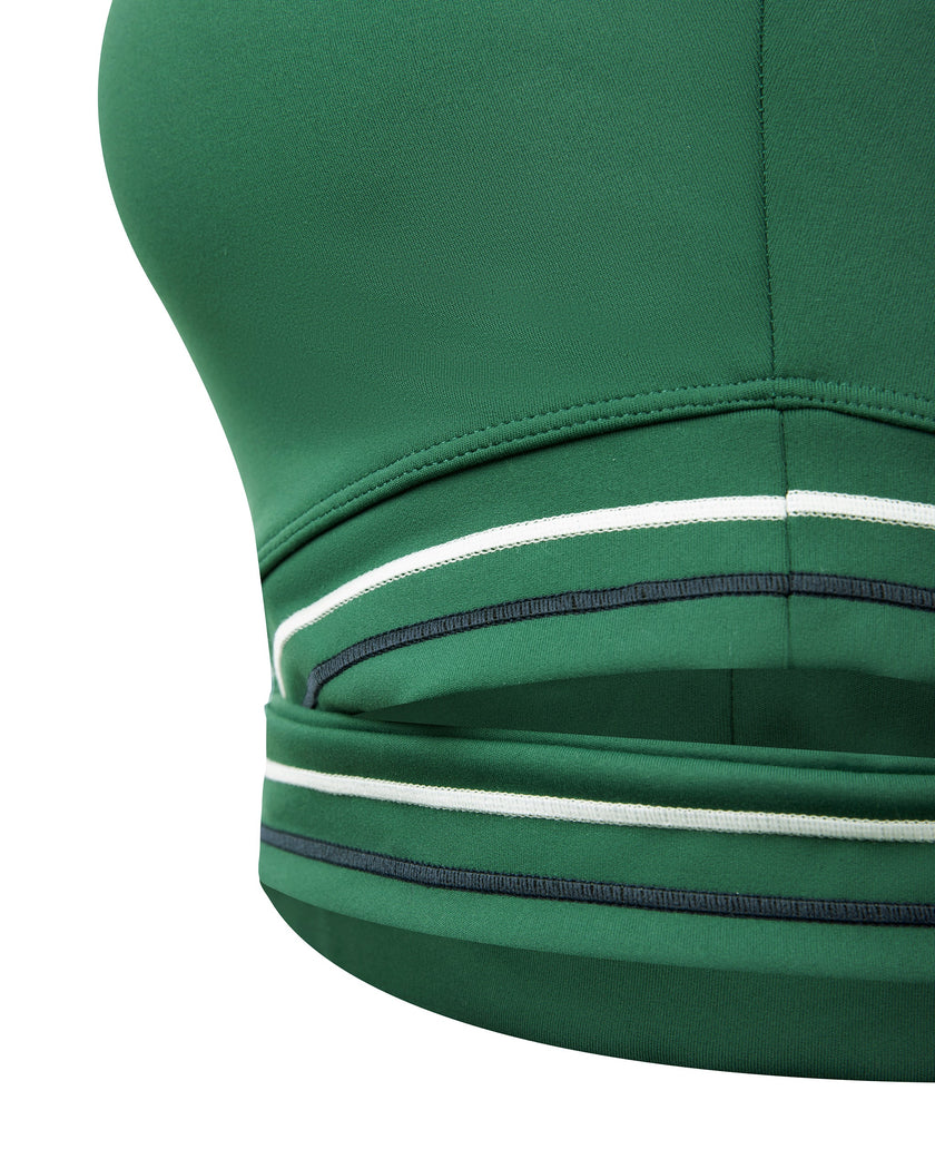 Criss-cross underbust band closeup of TrackLine Rally Sports Bra in blackish green