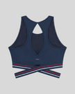 Back view of TrackLine Rally Sports Bra in navy blue with open-back athletic design