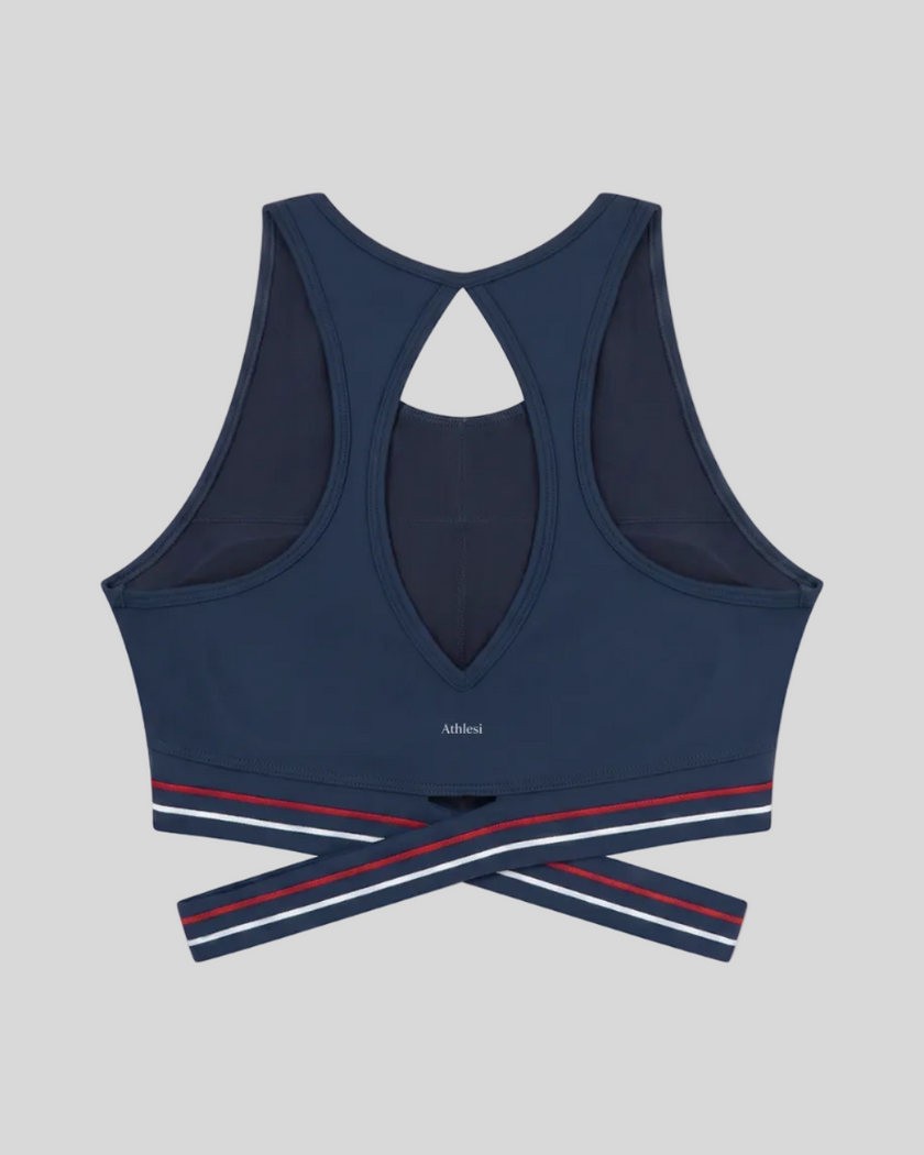 Back view of TrackLine Rally Sports Bra in navy blue with open-back athletic design