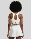 Back view of TrackLine Rally Sports Bra in white featuring open-back design