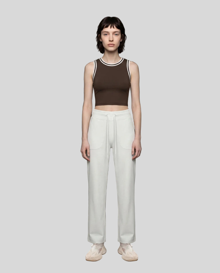 Model wearing the TrackLine Rally Tank in Coffee with White, full body view.