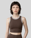 Model wearing the TrackLine Rally Tank in Coffee with White, front view.