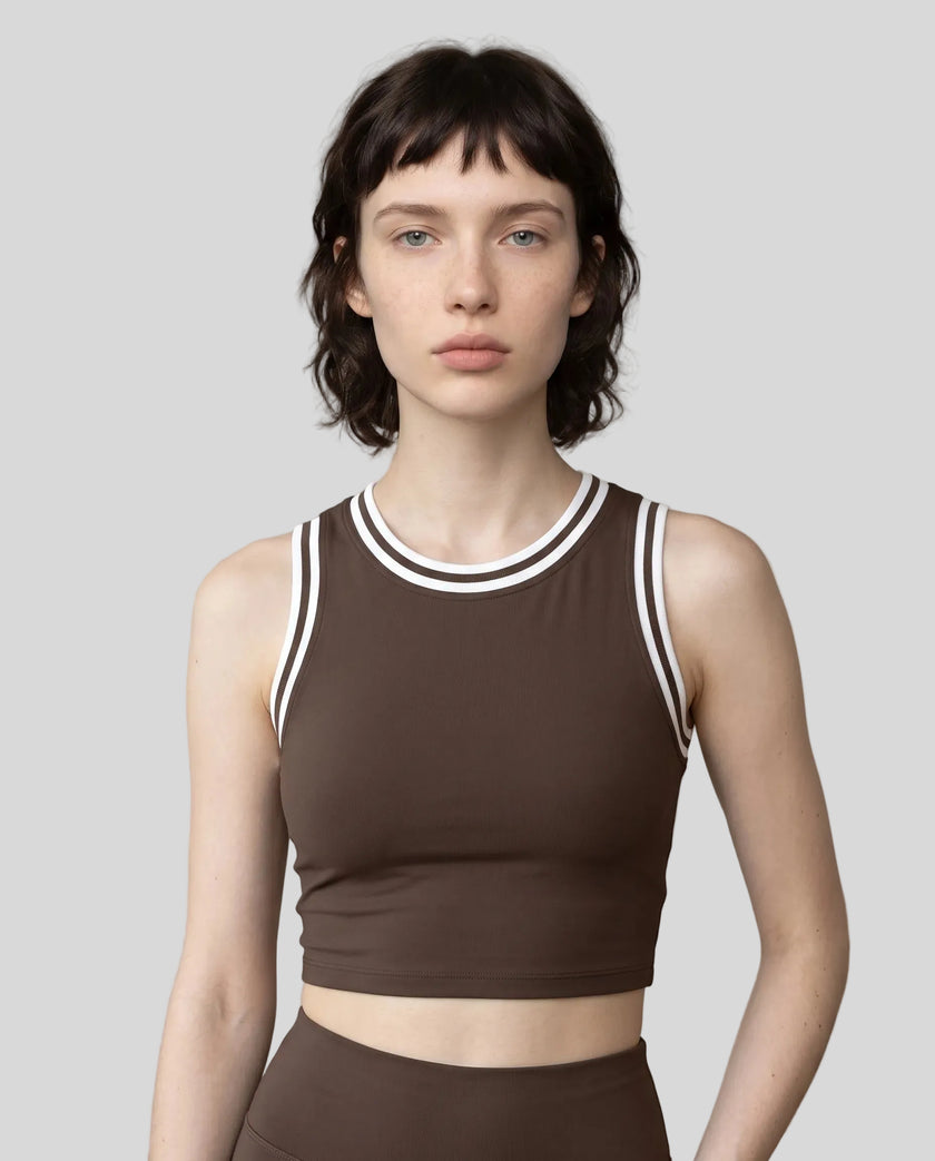 Model wearing the TrackLine Rally Tank in Coffee with White, front view.